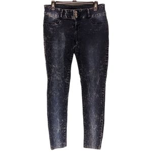 Skinny acid wash denim jeans with skull grommet and dual button zipper fly